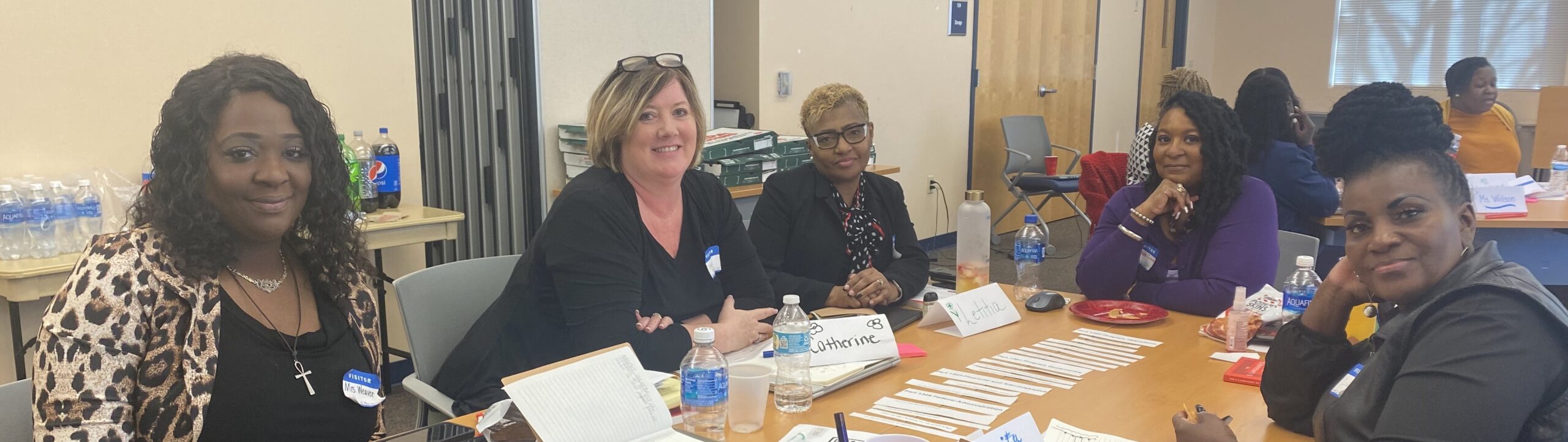 Four Head Start leaders collaborating at an in-person training.