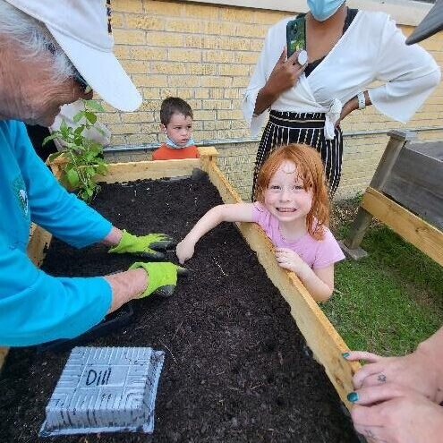 Children at Taconi Head Start work in the Herb and Vegetable Garden and sample green onions 2 Children at Taconi Head Start work in the Herb and Vegetable Garden and sample green onions 2